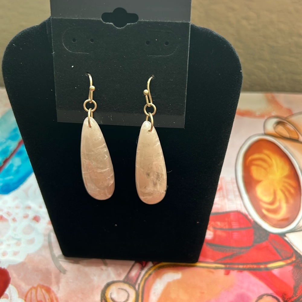 Creamy color pierced earrings. Gold tone fish hook.